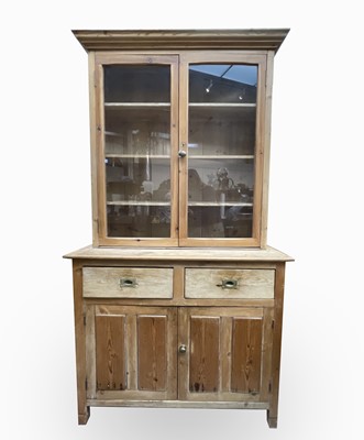 Lot 3210 - A Victorian stripped pine kitchen dresser, the...
