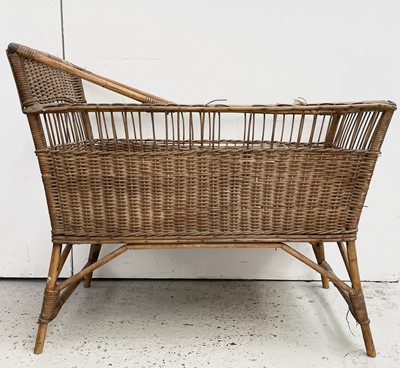 Lot 3238 - A wicker cot, early 20th century, width 94cm.
