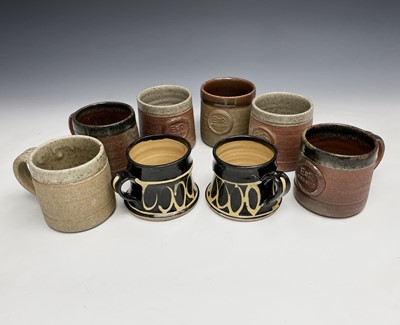 Lot 1135 - Six Mulchelney stoneware studio pottery mugs,...