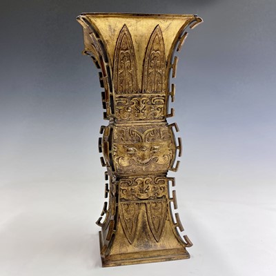 Lot 69 - A Chinese gilt bronze Gu-shaped vase, long...
