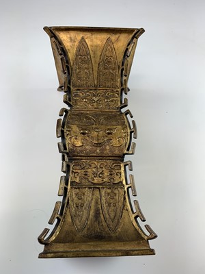 Lot 69 - A Chinese gilt bronze Gu-shaped vase, long...