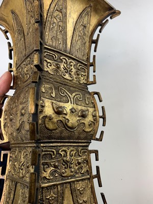 Lot 69 - A Chinese gilt bronze Gu-shaped vase, long...
