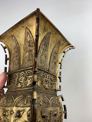 Lot 69 - A Chinese gilt bronze Gu-shaped vase, long...