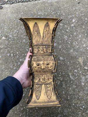 Lot 69 - A Chinese gilt bronze Gu-shaped vase, long...
