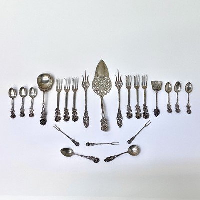 Lot 14 - A collection of white metal cutlery with cast...
