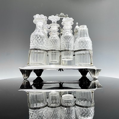 Lot 16 - A George III silver seven bottle cruet frame...