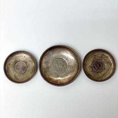 Lot 17 - A pair of silver pin trays, each set with an...