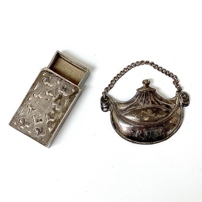 Lot 18 - A Georgian silver RUM spirit label, together...