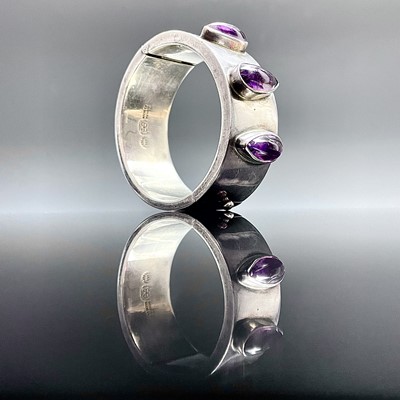 Lot 670 - A Mexican heavy sterling 925 hinged bangle by...