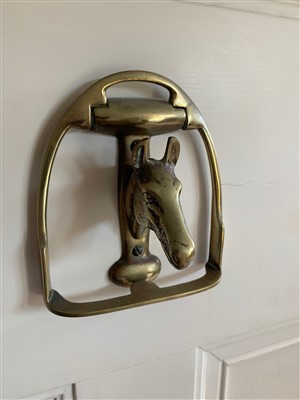 Lot 8 - A brass door knocker in the form of a horse's...