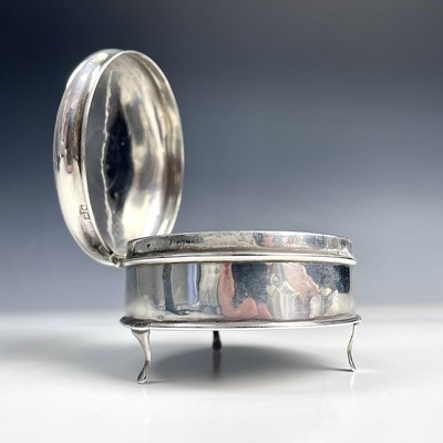 Lot 35 - A George V silver circular engine turned hinge...