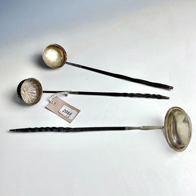 Lot 40 - Three Georgian silver toddy ladles, the bowls...