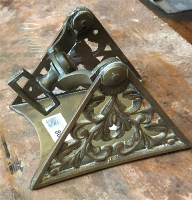 Lot 80 - A late 19th century brass stirrup iron.