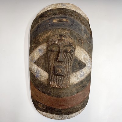 Lot 75 - A Songye type African shield, length 54cm.