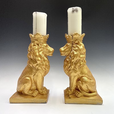 Lot 111 - Pair of gold painted lions with candles,...