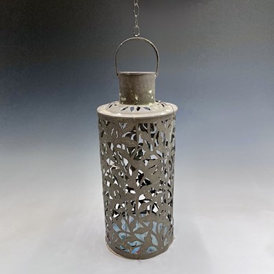 Lot 145 - A pierced brass hanging candle holder...