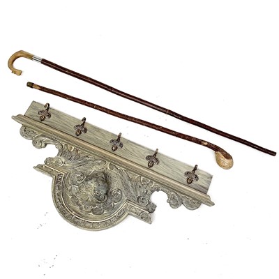 Lot 196 - A painted oak coat rack with five brass hooks...