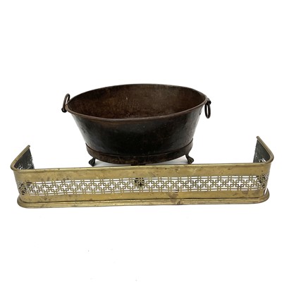 Lot 64 - An oval iron log bin with twin ring handles on...