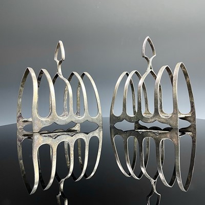 Lot 54 - A pair of George V silver four section toast...