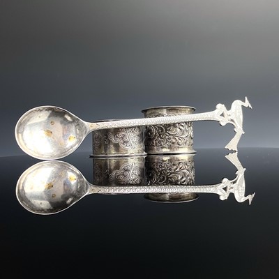 Lot 57 - A Persian silver olive spoon with peacock...