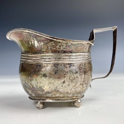 Lot 63 - A George III silver milk jug with ribbed...