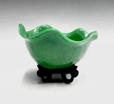 Lot 62 - A Chinese Peking green glass bowl, on carved...