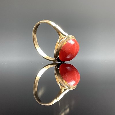 Lot 713 - A modern 18ct gold coral set dress ring,...