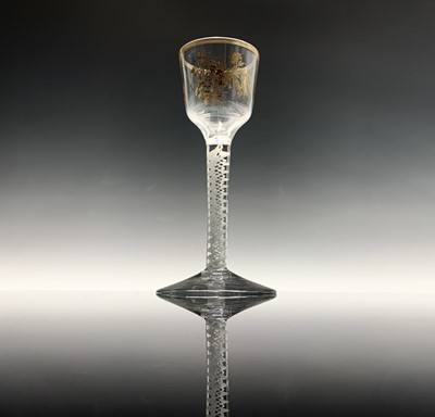 Lot 1015 - An early George III wine glass, the ogee bowl...