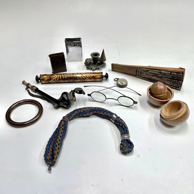 Lot 61 - A Regency miniature cast brass taper holder...