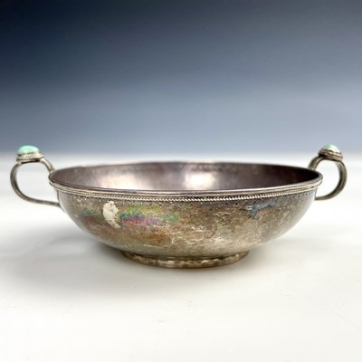 Lot 70 - An eastern silver twin handled wine taster,...