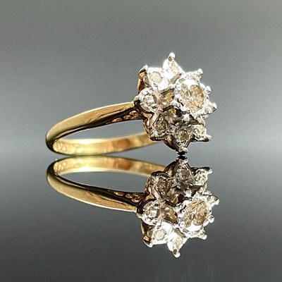 Lot 762 - An 18ct hallmarked gold diamond cluster nine...