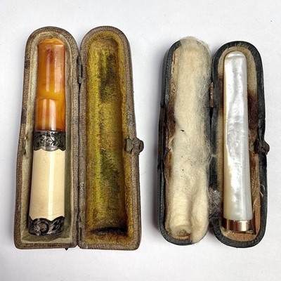 Lot 238 - A George V 9ct gold mounted cigarette holder...