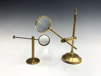 Lot 204 - A 19th century brass pillar extending desk...