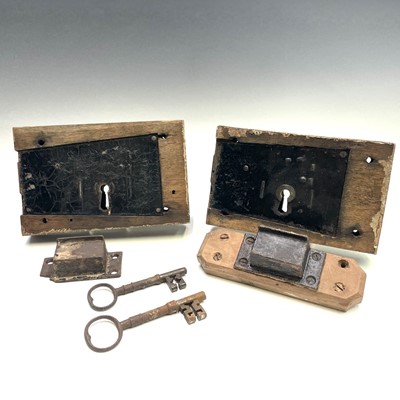 Lot 106 - A 19th century iron door lock and key the oak...