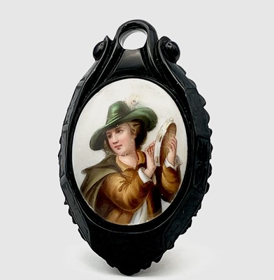 Lot 665 - A Victorian Whitby carved Jet oval pendant set...
