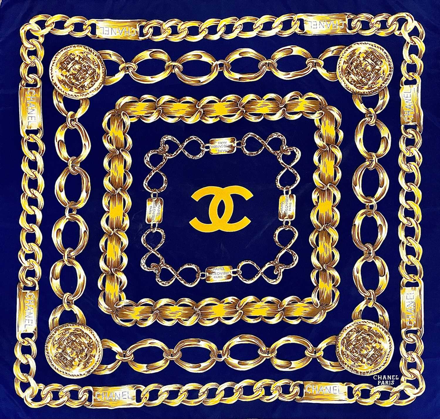 Lot 1030 - A Chanel printed silk scarf, 87cm square.