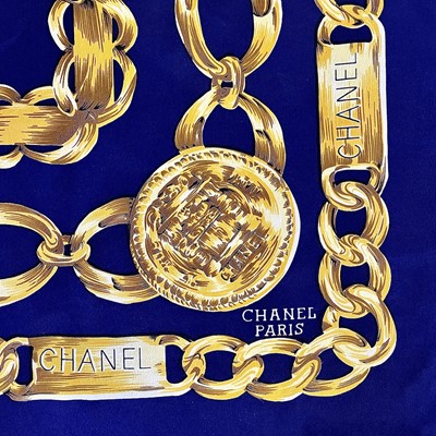 Lot 1030 - A Chanel printed silk scarf, 87cm square.