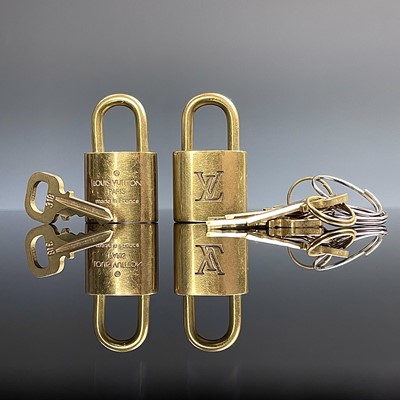 Lot 999 - Two Louis Vuitton lock and keys.