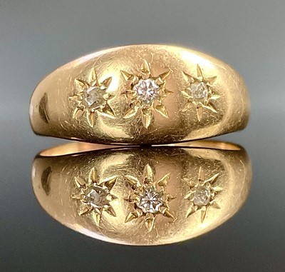 Lot 760 - An 18ct hallmarked gold diamond set three...