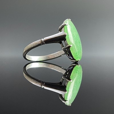 Lot 639 - An Art Deco white gold jade set ring, the...