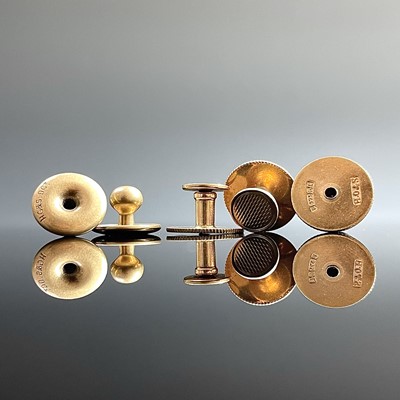 Lot 784 - A set of three 9ct gold engine turned shirt...