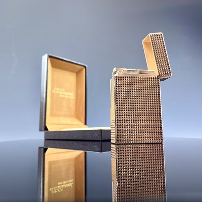 Lot 229 - A rose gold plated S. T. Dupond Paris lighter,...
