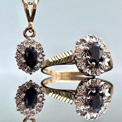 Lot 669 - A 9ct hallmarked diamond and sapphire cluster...