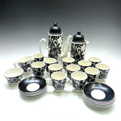 Lot 872 - A Carlton ware black sunflower pottery tea and...