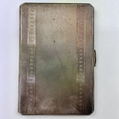 Lot 130 - A George VI silver engine turned cigarette...