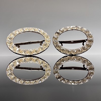 Lot 213 - A pair of Georgian steel paste set oval shoe...