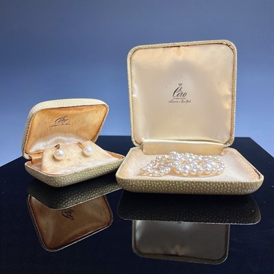 Lot 714 - A pair of 14k gold pearl set screw earrings by...