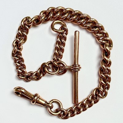Lot 782 - A 9ct rose gold graduated curb link Albert...