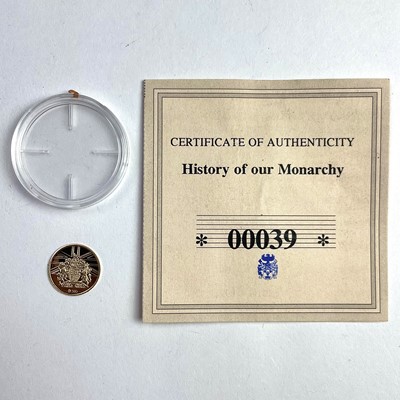 Lot 702 - A 14ct 2008 Prince Charles 60th Birthday...