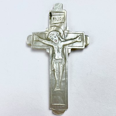 Lot 242 - A carved mother of pearl double sided crucifix,...